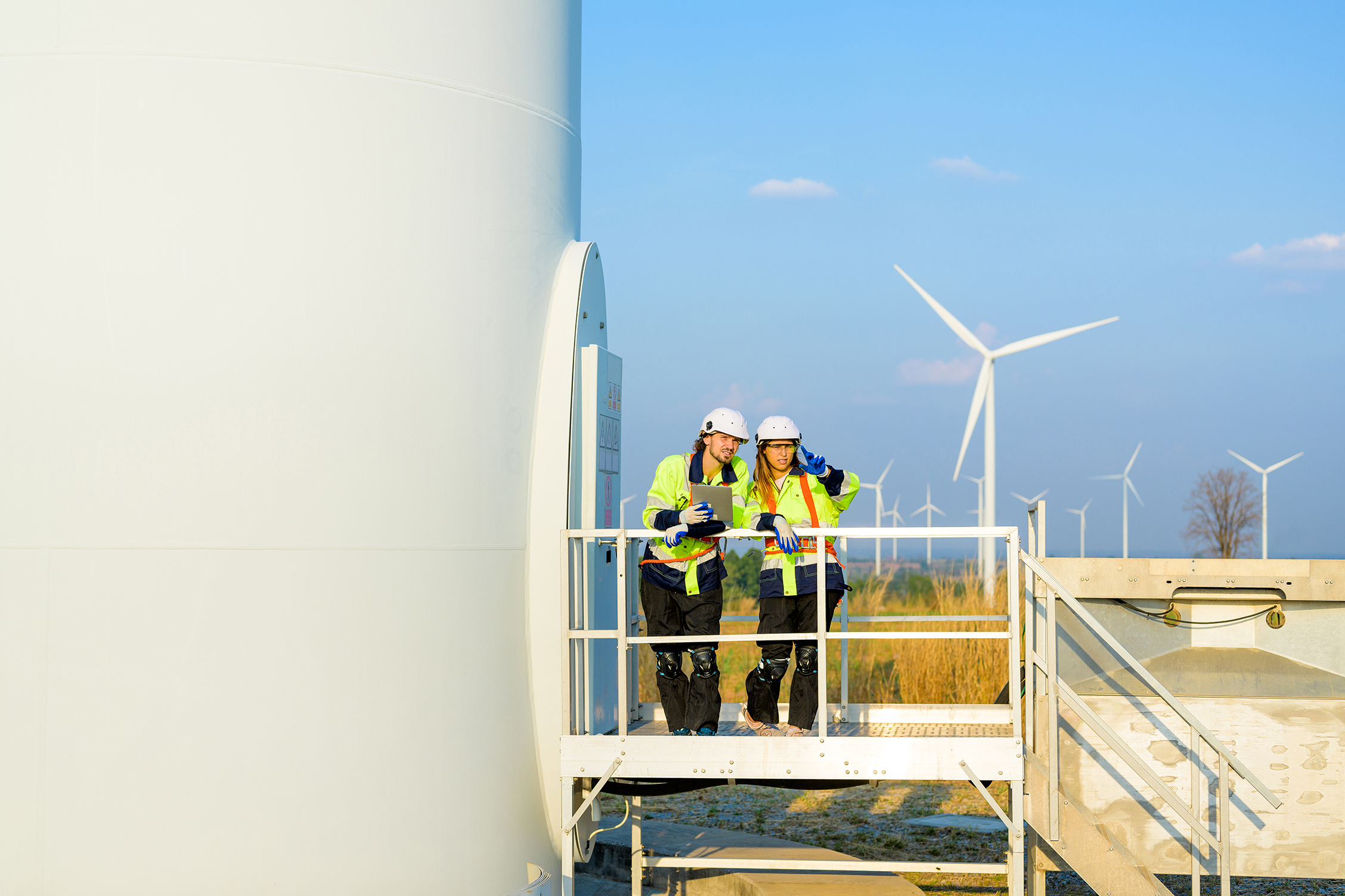 Renewable energy engineer working on wind turbine